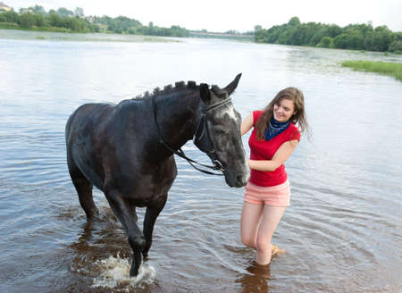 beautiful girl and her handsome horse.の写真素材