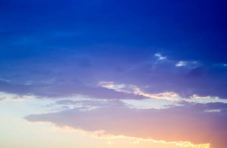 sunrise with clouds, light rays and other atmospheric effects.の写真素材