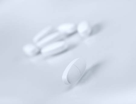 Tablets  ,Pills Spilling out of Pill Bottle closeup .Shallow depth-of-fieldの写真素材