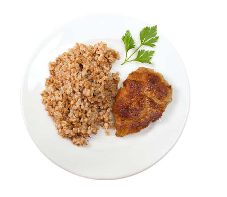 chops with buckwheat on plate.isolated on white backgroundの写真素材