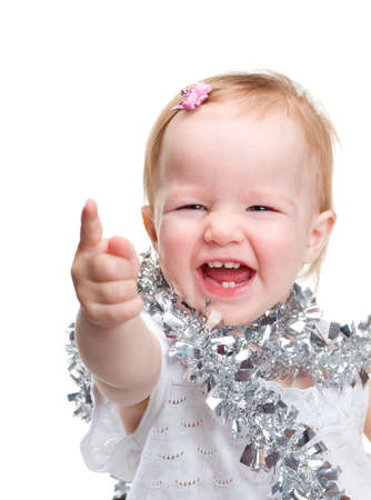 Image cute baby with Christmas decoration over white background の写真素材