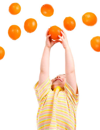 boy hunts for orange isolated on white backgroundの写真素材