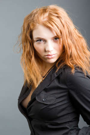 fashion portrait of a red hair sexy woman, studio shot 