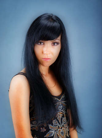   Attractive girl in black dress, studio shot  