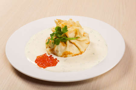 tasty home pancakes with  red caviar  on plateの写真素材