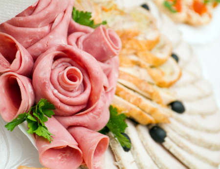 Beautiful sliced food arrangement with some vegetables. Shallow depth-of-field.  の写真素材