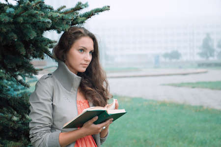 girl reads . misty morning