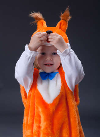 Little baby girl  dressed in a fox suit .Closeupの写真素材