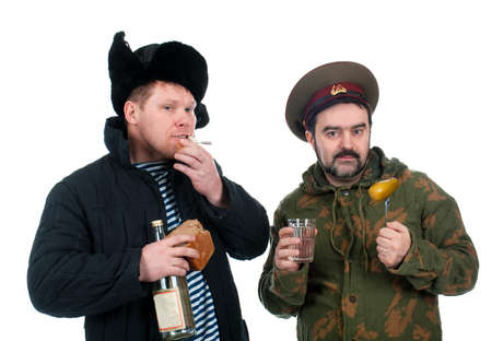 Russian soldier drinking vodka .isolated on white backgroundの写真素材