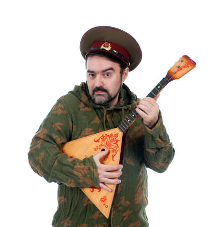 Russian soldier with balalaika isolated on white background の写真素材