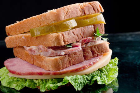 sandwiches with cheese and ham ,cucumber with reflection の写真素材