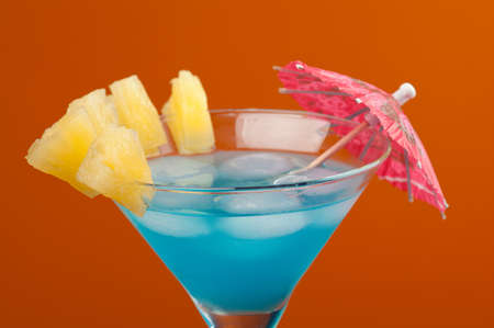 tropical cold cocktail  closeup on yellow background.の写真素材