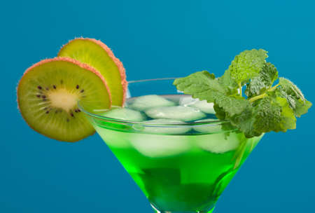 tropical green cold cocktail  closeup on yellow background.の写真素材