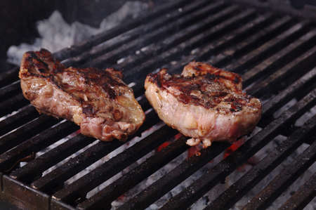 Sirloin steak prepared on the barbecue grill.  Shallow depth-of-field.