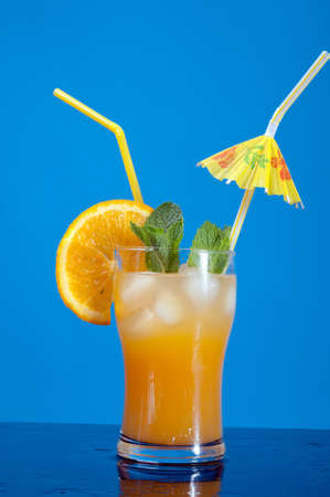 Mojito orange cocktail.on blue background.の写真素材