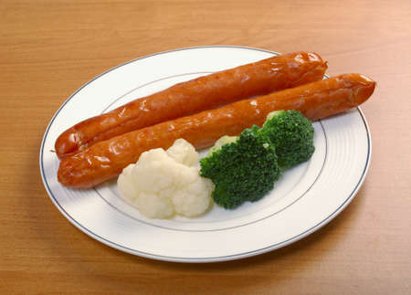 Sausages with broccoli and cauliflower . close up の写真素材