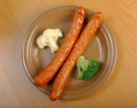 Sausages with broccoli and cauliflower . close up . Shallow depth-of-fieldの写真素材