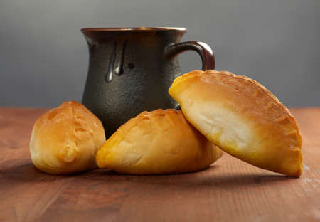 pierogi .Home cake with jam against the wooden tableの写真素材