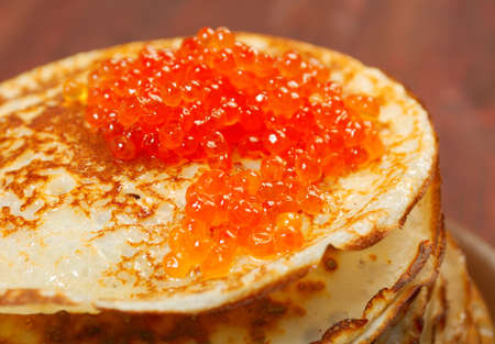 Traditional Russian pancakes  with red caviarの写真素材