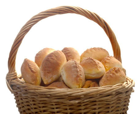 Basket full of pasties isolated  on whiteの写真素材