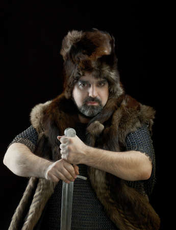 	Cimmerian.barbarian  Warrior.Medieval knight in the armor with the sword.