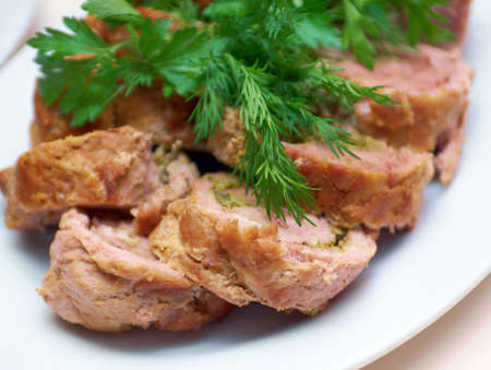 Toasted fried meat roll and it's slices on plate 