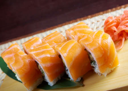 Uramaki. Philadelphia classic. Salmon, Philadelphia cheese, cucumber, avocado, tobiko. Japanese sushiの写真素材