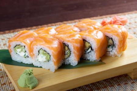 Uramaki. Philadelphia classic. Salmon, Philadelphia cheese, cucumber, avocado, tobiko. Japanese sushiの写真素材