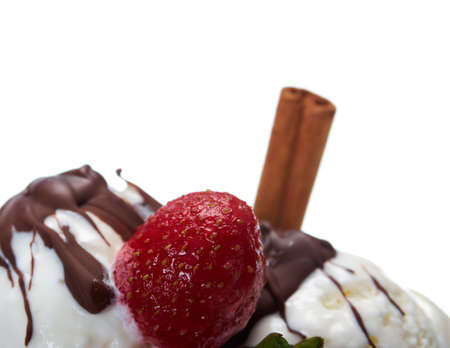 ice cream  with chocolate sauce and strawberries,cinnamon. closeup.isolated on white background.の写真素材