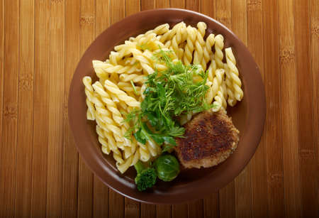 delicious macaroni pasta  with beef cutlets,vegetableonの写真素材