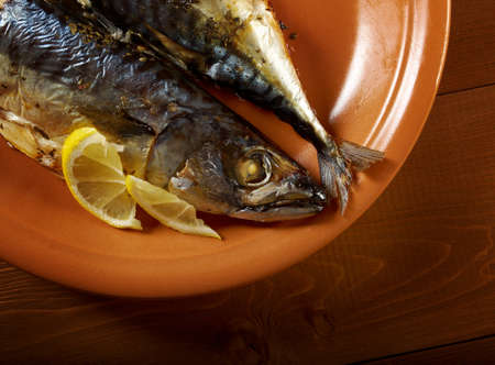 Mackerel on a grill  Fish prepared  with a lemonの写真素材