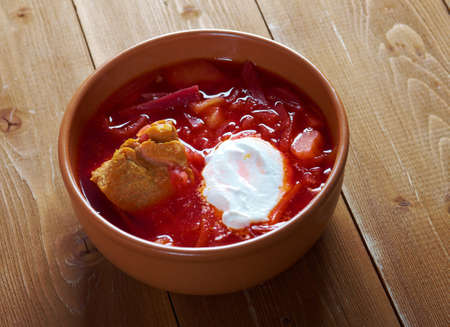 ukrainian and russian red-beet soup (borscht) with garlic and sour creamの写真素材