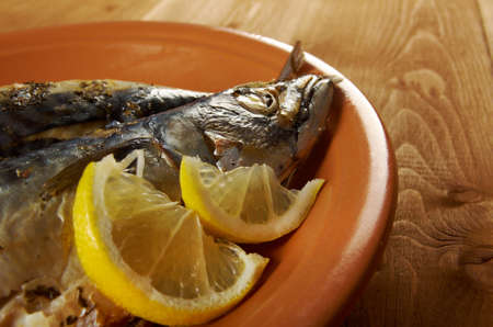 Mackerel on a grill. Fish prepared  with a lemonの写真素材