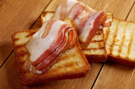 pile  toasted bread slices for bacon.Close up of toasted white bread in slicesの写真素材