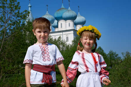  Russian Little boy and girl  on a orthodox church backgroundの写真素材