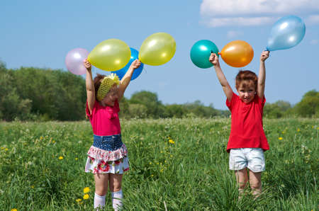 children with balloon outdoorの写真素材