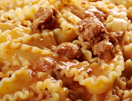 Italian pasta mafalde with  beef ,sour cream and  tomato sauce の写真素材