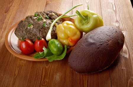 roast beef farm-style with vegetable and bread .farmhouse kitchenの写真素材