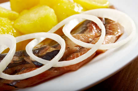 herring fish fillets with potato and onionの写真素材