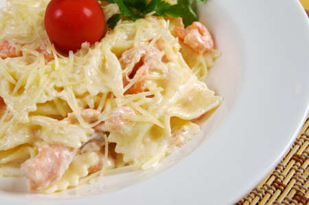 Farfalle pasta with salmon  and tomatoesの写真素材