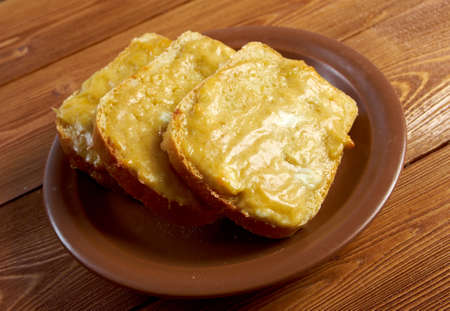 Welsh Rarebit - Toasted  bread with melted cheddar cheese