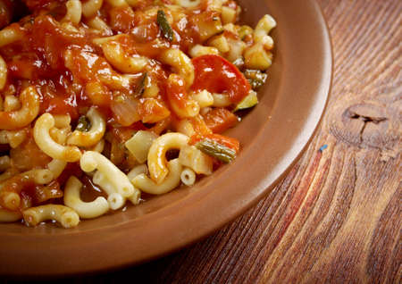 homemade elbow macaroni pasta with  vegetable and tomato sauceの写真素材