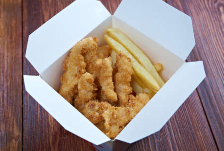 Fries  and Chicken Nuggets.closeup in take-out boxの写真素材