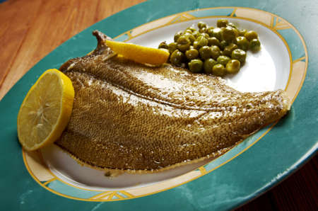 Baked Flounder with vegetables and lemon の写真素材