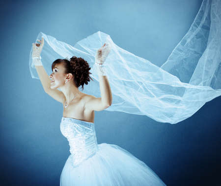 Beauty young bride dressed in elegance white wedding dressの写真素材