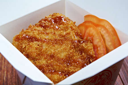 Pork roasted coating. traditional japanese food in take-out box