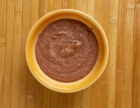 Refried beans dish of cooked and mashed beans and is a traditional staple of Mexican and Tex-Mex...