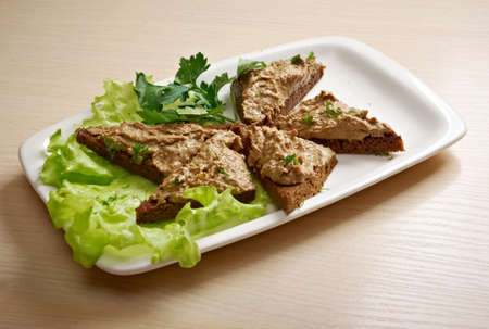 Slices of toasted bread with delicious liver pateの写真素材