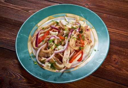 Calamari in padella.	mediterranean cuisine.roasted squids with vegetableの写真素材