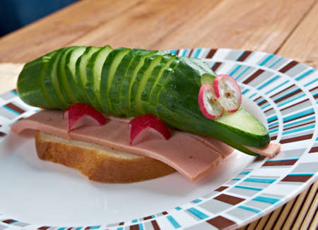 breakfast for child.crocodile sandwich sausage and cucumberの写真素材